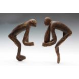 West Papua, Asmat, two anthropomorphic figures, male and female with flexed legs and arms, both with