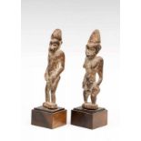 Ivory Coast, a pair of forest spirits, tugubele, male and female, the latter with scarification on