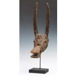 Nigeria, Mama, antelope mask with cylindrical upright horns, broad flat protruding mouth, edged head