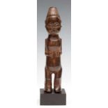 DRC., standing figure with hole in head with plant fibers, arms on belly, C-shapes ears, and black-