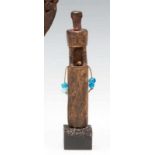 West Papua, Teluk Cenderawasih, fishing amulet of a squating antropomorfic figure on a high pole,