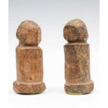 West Africa, two abstract wooden column figures with faceted face and encrusted patina. h. 17 cm. [