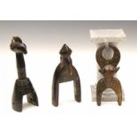 Ivory Coast, Senufo, three wooden pulley's. h. 14 and 16 cm. [3]