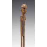 DRC., Yaka, wooden two legged comb decorated with female buste. h. 15,5 cm. [1]