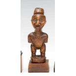 DRC., Yombe, wooden figure, with bulbous head for attachment power material, small arms, slightly