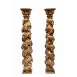 A pair of gilt pinewood twisted columns. With decoration of carved vines. With Corinthian