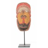 PNG, Abelam, wooden yam mask, the finely carved oval face with hair ridge and beard, elongated