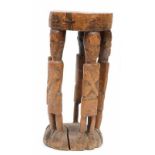 DRC., Kuba, wooden stool, with five standing figures as support. h. 53 cm. [1]