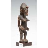 Ivory Coast, Senufo, female figure with pointed breast, body scarification's, hands against her