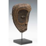 DRC., Lulua, wooden mask, with large concave eye sockets, narrow oval eyes, metal nose ring and