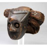 DRC, Kuba Kingdom, wooden mask with fine woven raffia hairdress with bound kauri shells and beads.