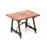 A 17th century miniature table, Spain. The oak top inlaid with tortoise fields and waved intarsia