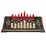Schachspiel England, Kolonialzeit um 1860. Elfenbein vollrd. geschnitzt zur Hälfte rot gefärbt.
