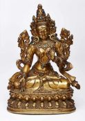 Göttin Tara, Tibet wohl 19. Jh. Bronze, vergoldet, kl. Türkisperlchen-Besatz. Sitzend auf