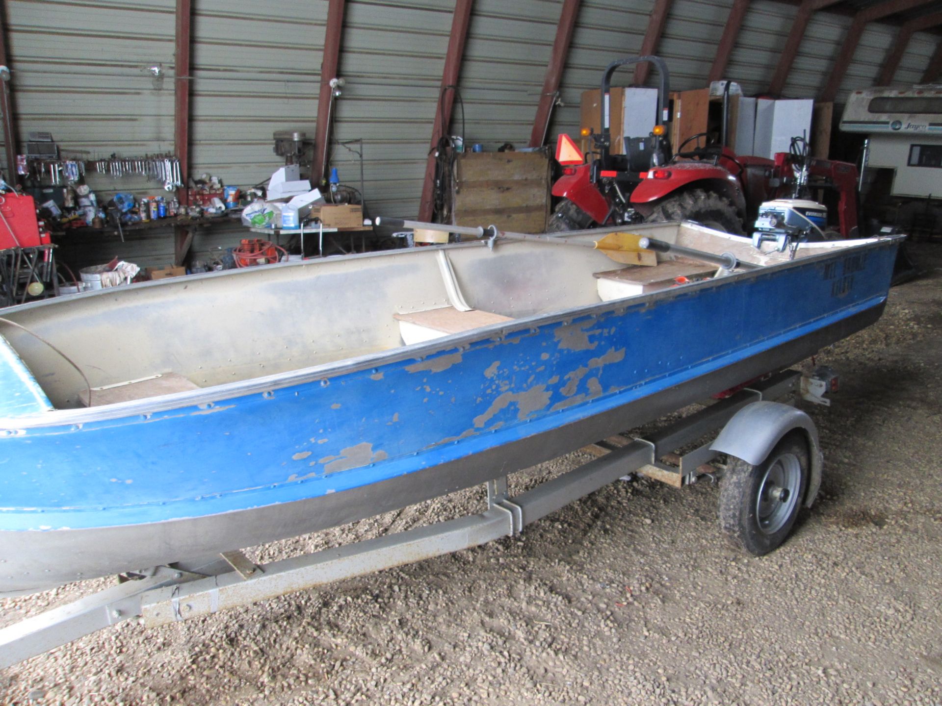 14' Aluminum boat, 15 hp Evinrude c/w trailer