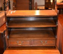 A small mahogany wall shelf with two short drawers, 56cm high, 57cm wide