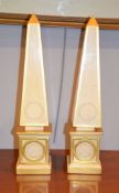 A pair of painted and parcel gilt obelisks, each 48cm high