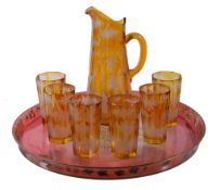 A Bohemian amber-flashed and clear glass part lemonade set, late 19th century