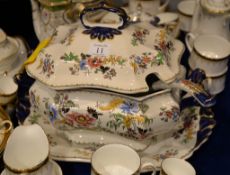 An English ironstone soup tureen with ladle