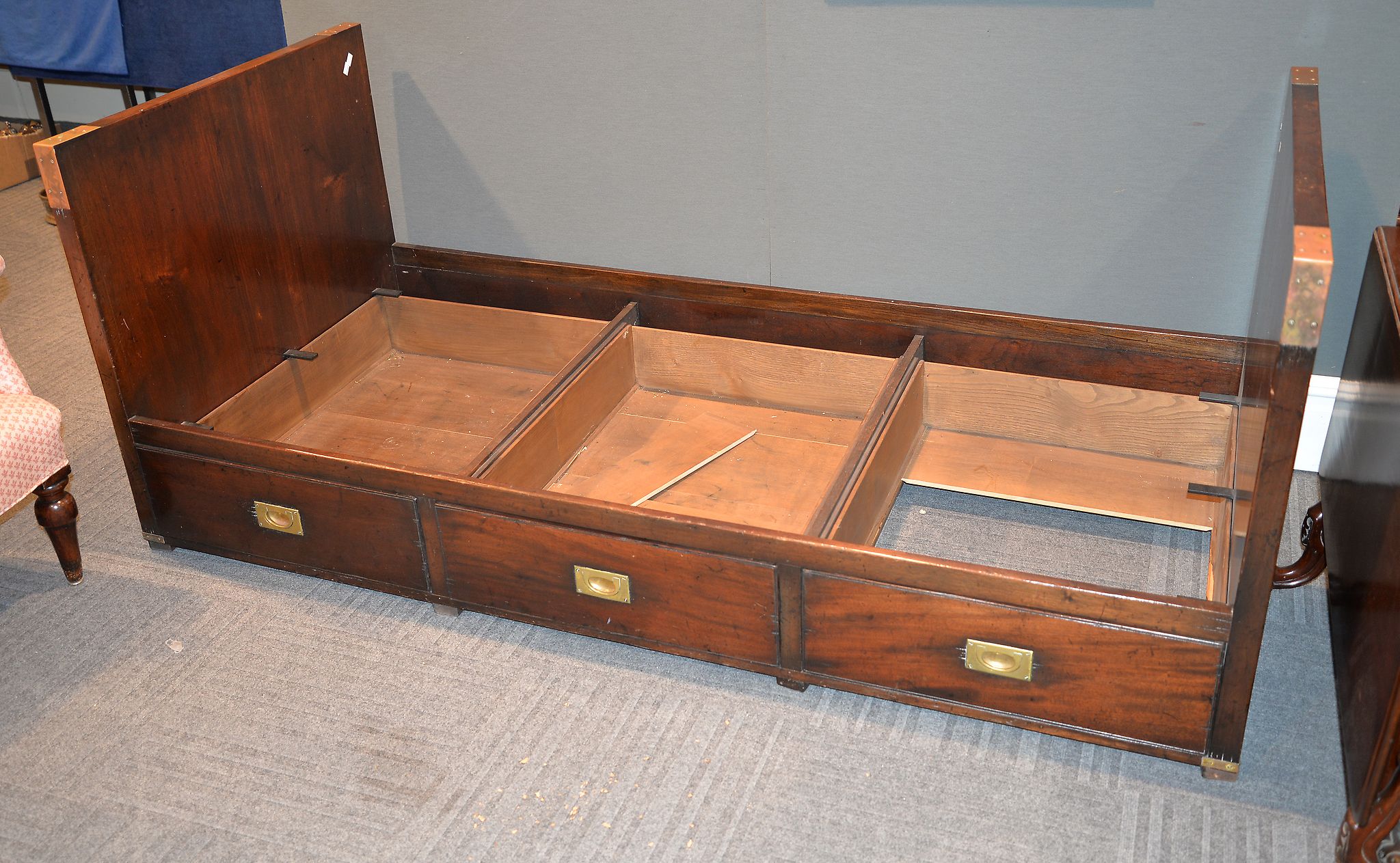 A stained wood campaign type bed in 19th century style, 20th century, 84cm high