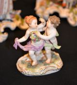 A Meissen group of two putti dancing, blue crossed swords mark, circa 1880