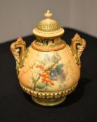 A Royal Worcester ivory-ground two-handled pot-pourri vase and cover