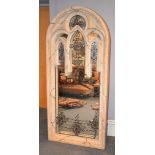 A composition stone mirror in Gothic Revival taste, on a metal base