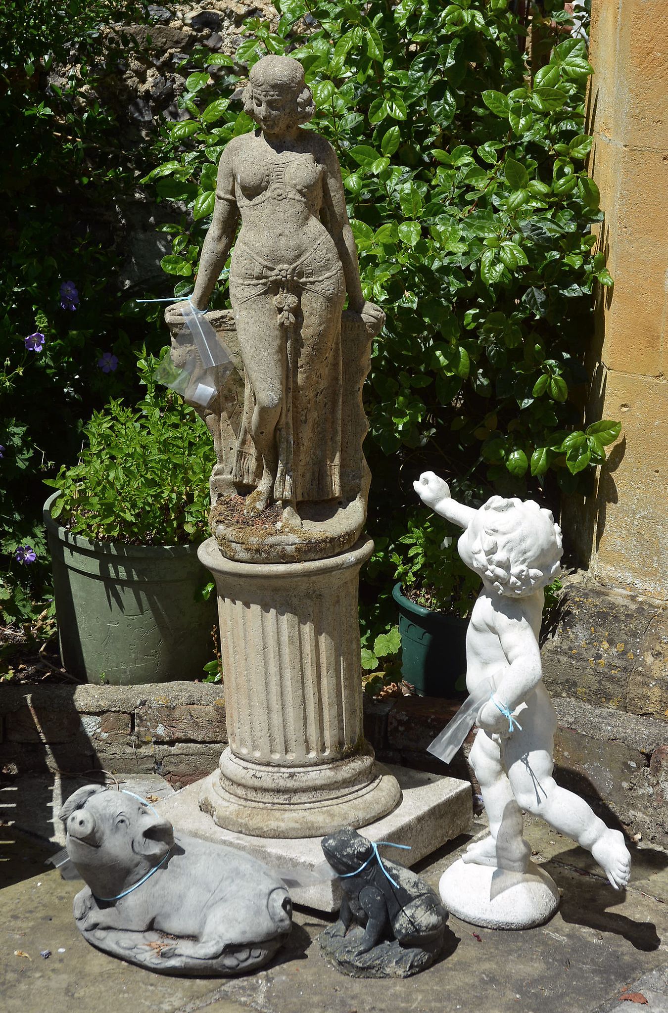 A stone composition garden model of a maiden