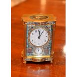 A French lacquered brass and champleve style enamel carriage timepiece