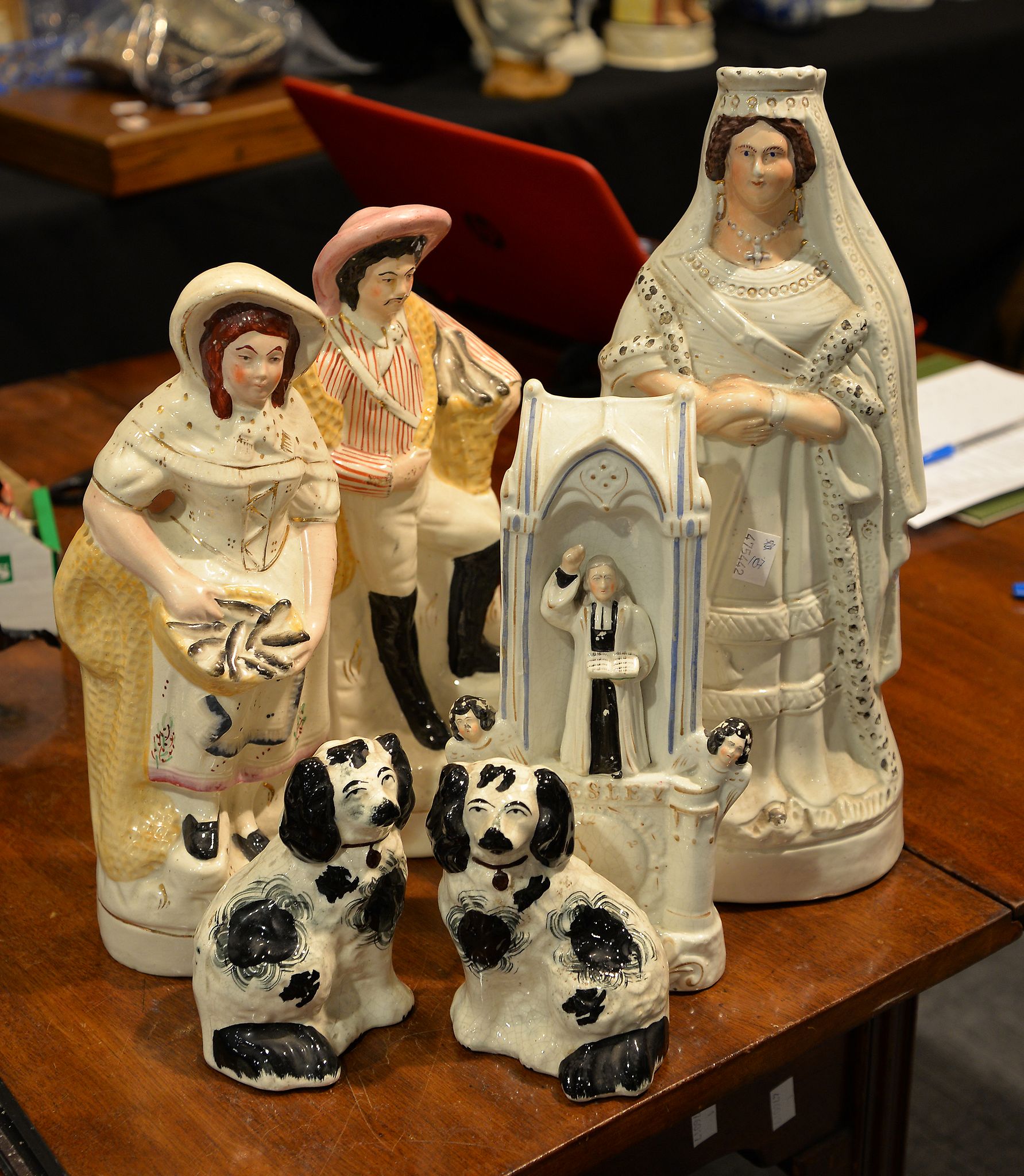 A pair of 19th century Staffordshire black and white pottery spaniels