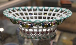 A Meissen pierced oval basket, modelled with a garland of flowers and leaves