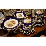 A Derby blue ground part dessert service painted with titled English landscapes