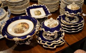 A Derby blue ground part dessert service painted with titled English landscapes