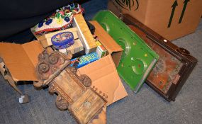 A box containing assorted toys and games, include two vintage hand puppets