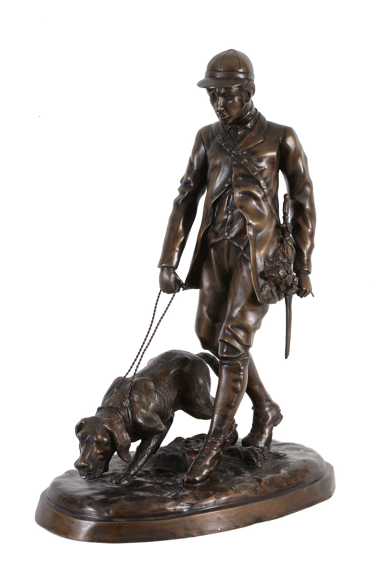 A patinated metal group of a huntsman and hound in late 19th century taste