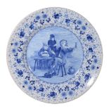 A large Dutch Delft blue and white charger, circa 1900
