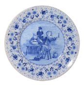 A large Dutch Delft blue and white charger, circa 1900