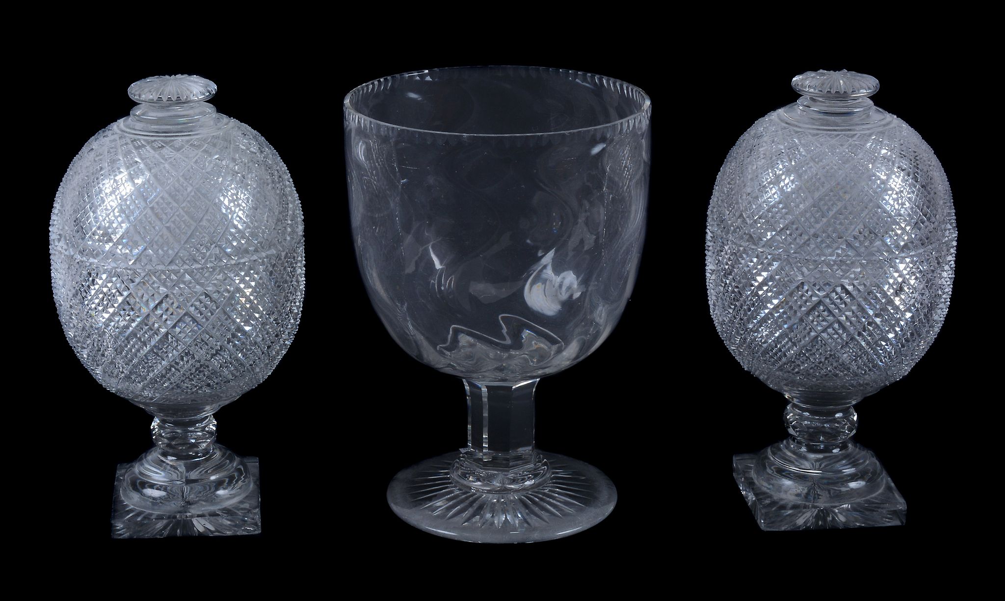 A pair of English cut-glass bonbonieres and covers in the Regency style