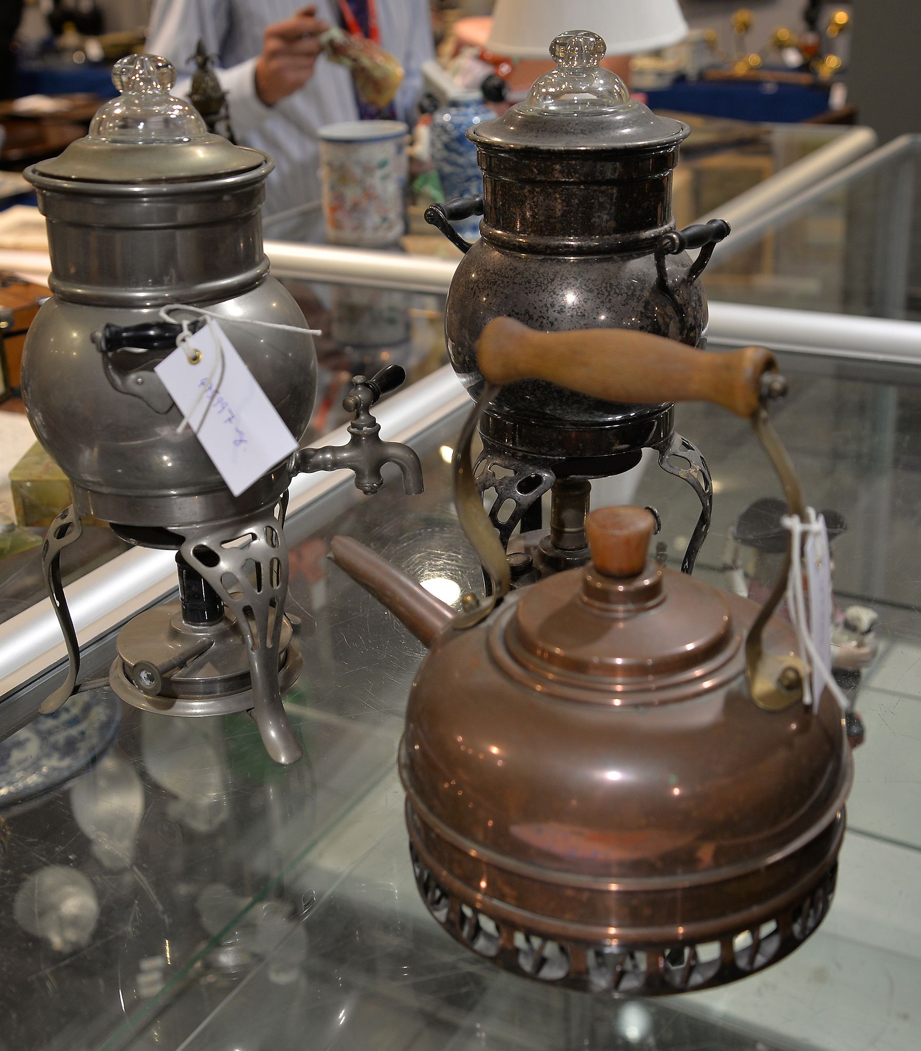 A copper kettle, and two similar small samovars