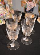 A set of five Baccarat wine glasses, engraved with game birds