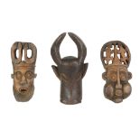 A group of West African wood masks, mainly Cameroon region