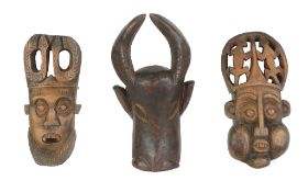 A group of West African wood masks, mainly Cameroon region