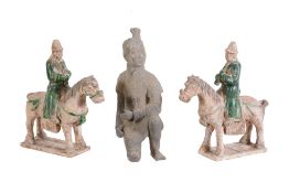 A pair of Tang style pottery horses and riders