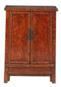 A Chinese hardwood cabinet, in Ming style, late 19th/ early 20th century