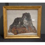 A 19th century beadwork picture of a spaniel seated on a cushion, 26 x 30cm