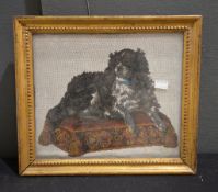 A 19th century beadwork picture of a spaniel seated on a cushion, 26 x 30cm