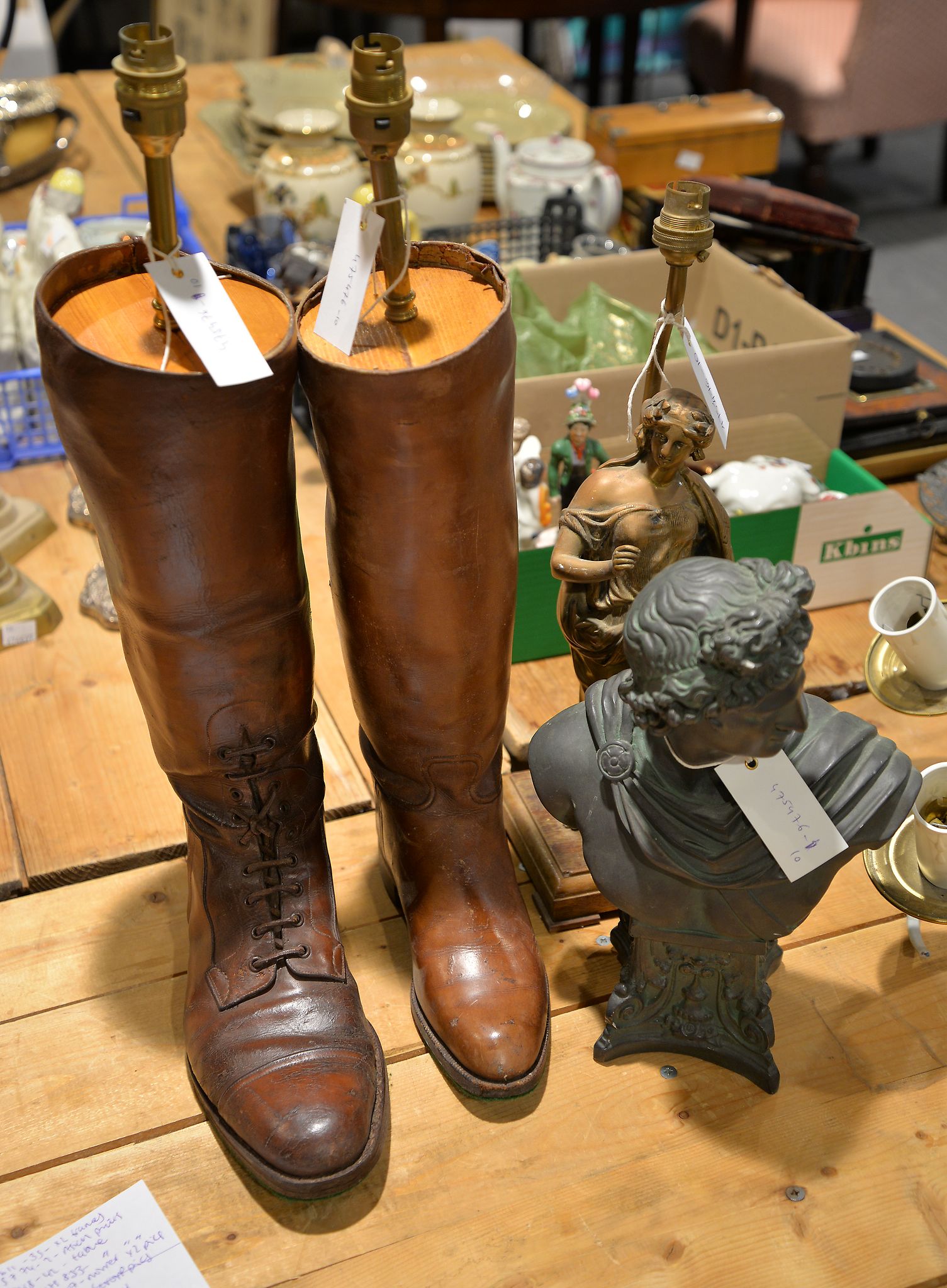 A figural lamp, resin bust, pair of boots