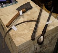An iron axe with wood shaft; a large tool, possibly a screwdriver