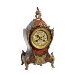 A French simulated tortoiseshell and boule inlaid mantel clock