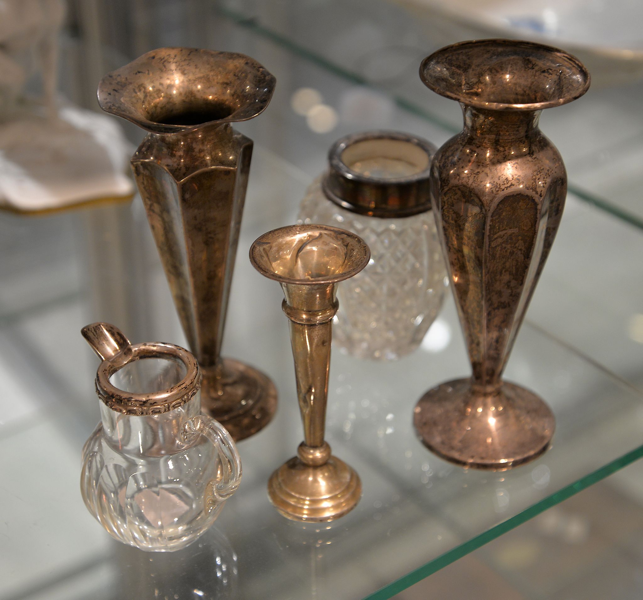 A pair of silver spill vases, another smaller similar